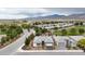 Beautiful aerial view of a single-story home with manicured landscaping in a golf course community at 4844 E Cactus Canyon Dr, Pahrump, NV 89061