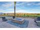 Outdoor fire pit and seating area with beautiful views of the community and picturesque mountains at 4844 E Cactus Canyon Dr, Pahrump, NV 89061