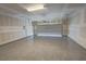 Spacious two car garage with epoxy flooring and freshly painted drywall at 4844 E Cactus Canyon Dr, Pahrump, NV 89061