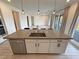 Bright kitchen boasts a large island with a sink and modern fixtures at 4844 E Cactus Canyon Dr, Pahrump, NV 89061