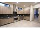 Modern kitchen featuring wood cabinets, stainless steel appliances, and sleek countertops at 4844 E Cactus Canyon Dr, Pahrump, NV 89061