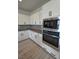 Kitchen featuring white cabinets, stainless steel appliances, and modern finishes at 4844 E Cactus Canyon Dr, Pahrump, NV 89061