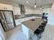Eat-in kitchen features a spacious island with seating and stainless steel appliances at 4844 E Cactus Canyon Dr, Pahrump, NV 89061