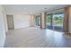 Open living room with tile flooring, ceiling fan, and sliding doors to an outdoor space at 4844 E Cactus Canyon Dr, Pahrump, NV 89061