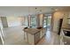 Open concept living area combines kitchen and great room with views of backyard at 4844 E Cactus Canyon Dr, Pahrump, NV 89061