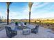 Relax in a beautiful outdoor seating area with a fire pit and stunning desert views at 4844 E Cactus Canyon Dr, Pahrump, NV 89061