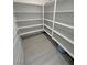 Walk-in pantry features bright white shelving and wood look flooring at 4844 E Cactus Canyon Dr, Pahrump, NV 89061