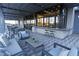 Comfortable outdoor patio seating area with ceiling fan and convenient access to the inside lounge at 4844 E Cactus Canyon Dr, Pahrump, NV 89061