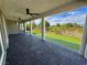 Enjoy outdoor living on this home's covered patio, adjacent to the custom backyard putting green at 4844 E Cactus Canyon Dr, Pahrump, NV 89061