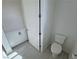 Efficient powder room with modern toilet, door, and vanity with storage cabinet at 4844 E Cactus Canyon Dr, Pahrump, NV 89061