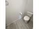 Bright powder room with toilet, ceramic tile flooring and neutral color palette at 4844 E Cactus Canyon Dr, Pahrump, NV 89061