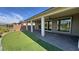 This home has a custom backyard putting green that backs onto the home's covered patio at 4844 E Cactus Canyon Dr, Pahrump, NV 89061