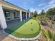 This home has a custom backyard putting green, surrounded by desert landscaping at 4844 E Cactus Canyon Dr, Pahrump, NV 89061