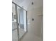 Modern shower featuring glass enclosure and contemporary fixtures with view into the bathroom at 4844 E Cactus Canyon Dr, Pahrump, NV 89061