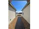 Paver walkway leads to landscaped front yard between white stucco walls against a blue sky at 4844 E Cactus Canyon Dr, Pahrump, NV 89061