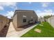 The backyard features a green lawn, rock area, and a stone path at 4940 Mascaro Dr, Las Vegas, NV 89122