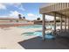 Outdoor community pool with sun chairs and hot tub area, perfect for relaxation and leisure at 4940 Mascaro Dr, Las Vegas, NV 89122