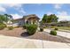 Charming single-story home with well-manicured landscaping and inviting walkway on a sunny day at 4940 Mascaro Dr, Las Vegas, NV 89122