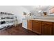 Functional kitchen with wooden cabinets, a sink, and a view into the adjoining living area at 4940 Mascaro Dr, Las Vegas, NV 89122