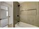 This renovated bathroom features a shower with tiled niche and black fixtures at 5020 Village Dr, Las Vegas, NV 89142