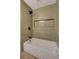 This renovated bathroom features a shower with tiled niche and new fixtures at 5020 Village Dr, Las Vegas, NV 89142