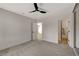 This bedroom features neutral paint, new carpet, and a ceiling fan at 5020 Village Dr, Las Vegas, NV 89142
