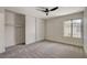 Spacious bedroom with large sliding closet and a window with outside view at 5020 Village Dr, Las Vegas, NV 89142