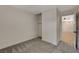 This bedroom features new carpet and closet with sliding doors at 5020 Village Dr, Las Vegas, NV 89142