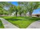 Park-like greenspace in a desirable community with mature trees and walking paths at 5020 Village Dr, Las Vegas, NV 89142