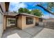 Charming home exterior featuring private courtyard, desert landscaping, and block wall at 5020 Village Dr, Las Vegas, NV 89142