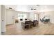 Inviting living room with large window providing natural light, neutral color palette, and open dining area at 5020 Village Dr, Las Vegas, NV 89142