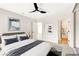 Inviting main bedroom featuring a ceiling fan and ensuite bathroom at 5020 Village Dr, Las Vegas, NV 89142