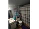 Cozy bathroom featuring a sleek vanity, decorative shelving, and modern fixtures at 5055 W Hacienda Ave # 1161, Las Vegas, NV 89118