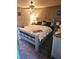 Comfortable bedroom featuring a stylish platform bed, soft carpet, and ample natural light at 5055 W Hacienda Ave # 1161, Las Vegas, NV 89118