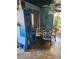 Dining area with a table for four, blue hutch, and sliding glass door to a patio at 5055 W Hacienda Ave # 1161, Las Vegas, NV 89118