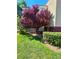 A view of the building exterior showcasing well-maintained landscaping and a lush lawn at 5055 W Hacienda Ave # 1161, Las Vegas, NV 89118