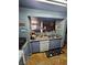 Kitchen featuring blue cabinets, granite counters, stainless steel appliances and a breakfast bar at 5055 W Hacienda Ave # 1161, Las Vegas, NV 89118
