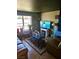 Comfortable living room with an entertainment center, coffee table, and large sofa at 5055 W Hacienda Ave # 1161, Las Vegas, NV 89118