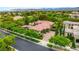 Stunning aerial view of the property, showcasing its lush landscaping, sparkling pool, and well-maintained exterior at 517 Spruce Canyon St, Las Vegas, NV 89144