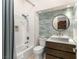 Stylish bathroom featuring unique tilework, a modern vanity, and a shower-tub combo for a relaxing experience at 517 Spruce Canyon St, Las Vegas, NV 89144