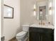 Modern powder room with stylish vanity, mirror, and elegant fixtures at 517 Spruce Canyon St, Las Vegas, NV 89144
