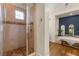 Bathroom featuring a walk-in shower with decorative tile and a soaking tub at 517 Spruce Canyon St, Las Vegas, NV 89144