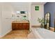 Bright bathroom featuring a soaking tub, vanity, and decorative mirror at 517 Spruce Canyon St, Las Vegas, NV 89144