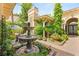 Lovely courtyard with a tranquil fountain and lush greenery creating a private outdoor oasis at 517 Spruce Canyon St, Las Vegas, NV 89144