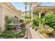Beautiful courtyard featuring a stone fountain and lush landscaping for a serene outdoor space at 517 Spruce Canyon St, Las Vegas, NV 89144