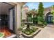 Lush courtyard with a decorative fountain and verdant landscaping, creating a tranquil outdoor living space at 517 Spruce Canyon St, Las Vegas, NV 89144