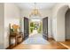 Elegant foyer with hardwood floors, stylish lighting, and a view of the lush courtyard at 517 Spruce Canyon St, Las Vegas, NV 89144