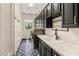 Modern laundry room with sleek cabinetry, a patterned floor, and updated appliances for efficient chores at 517 Spruce Canyon St, Las Vegas, NV 89144