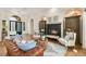 Elegant living room featuring a fireplace, hardwood floors, and stylish furnishings at 517 Spruce Canyon St, Las Vegas, NV 89144