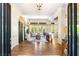 Spacious living room with hardwood floors, bright natural light, and a seamless indoor-outdoor flow at 517 Spruce Canyon St, Las Vegas, NV 89144